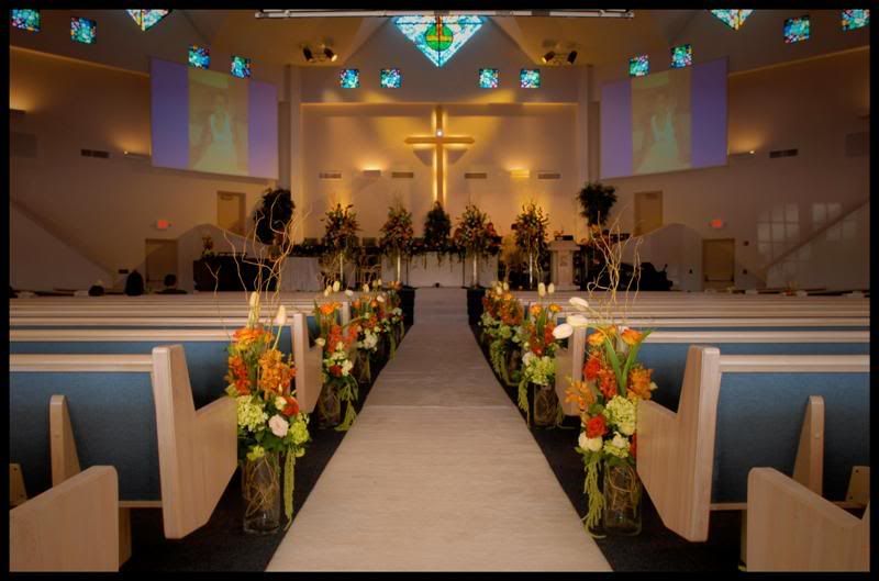 On the altar itself there were 4 large customized floral arrangements all 